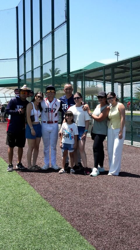 Group gathered by the baseball field