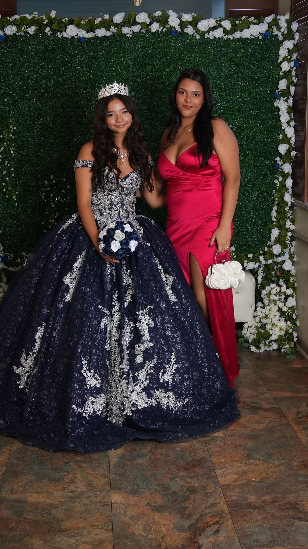The quinceañera with a guest in a red dress