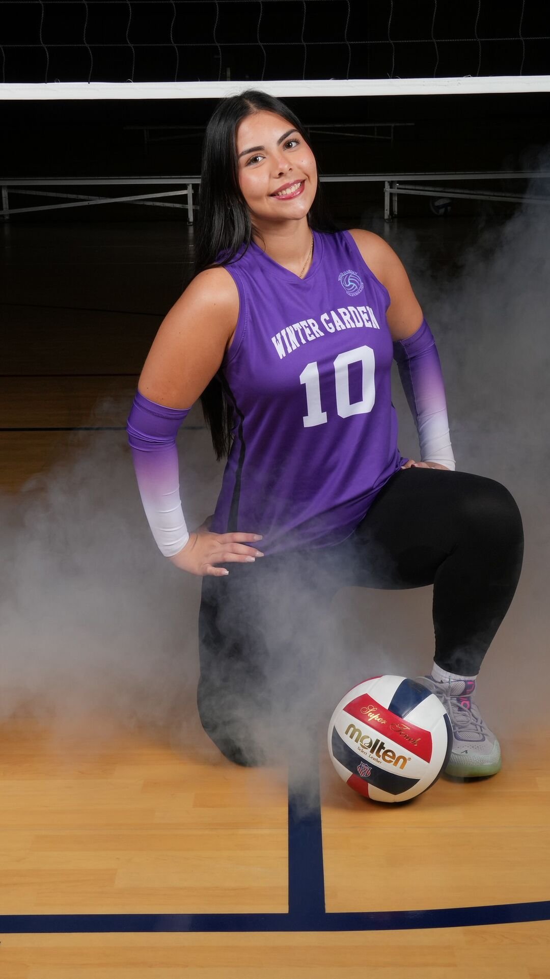 Player wearing number 10 sitting on the ball in the smoke