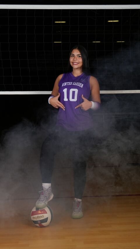Player standing in the smoke with the ball at her feet